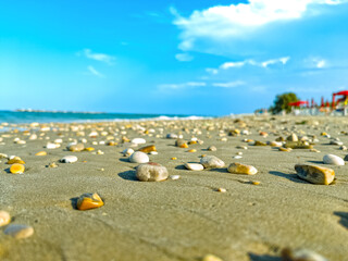 Pebbles on sandy beach