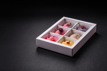 Delicious cold Japanese mochi dessert with colorful rice dough shell and fruit filling