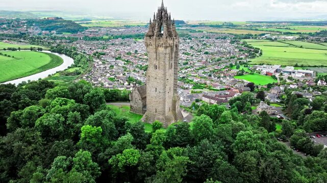Aerial view of Elaborate Victorian stone tower in Scotland, United Kingdom. The National Wallace Monument, famous landmark on a hilltop overlooking Stirling in Scotland.