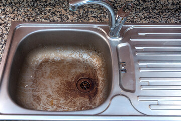 Close-up of a dirty sink in the kitchen
