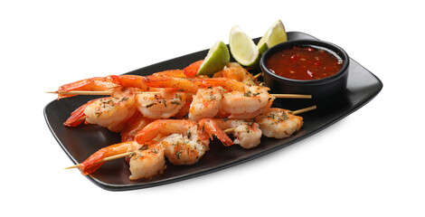 Delicious grilled shrimp skewers with sauce and lime isolated on white