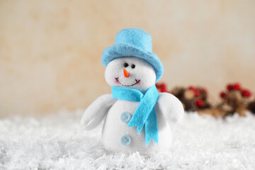 Funny decorative snowman figure on artificial snow