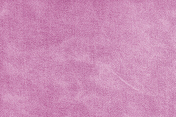 Closeup, macro pink grunge jeans denim fabric texture background, cloth with diagonal weawing