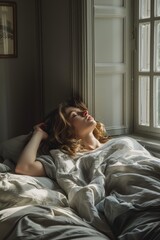Obraz premium A woman sleeping peacefully in a chic gray room with modern decor and soft lighting