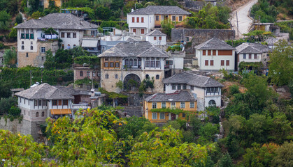 Cityscape of Gjirokaster old town, Albania. Christian church and old ottoman houses in Gjirokaster,...