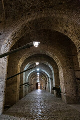 Gjirokaster, Albania - 7 September 2021: Old castle in Gjirokaster, Albania, cannons and arches 
