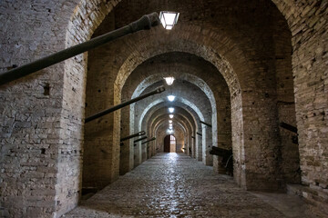 Gjirokaster, Albania - 7 September 2021: Old castle in Gjirokaster, Albania, cannons and arches 