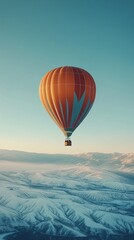Obraz premium Journey to Freedom: Lone Hot Air Balloon Soaring into Vast Clear Sky Inspiring Adventure and Freedom