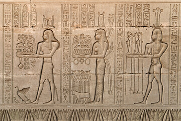 Wall relief at Hathor Temple showing an offering Scene of food ,wine , perfumes and crops. Dendera...