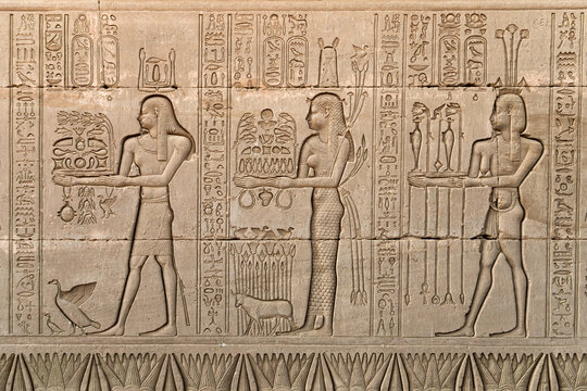 Wall relief at Hathor Temple showing an offering Scene of food ,wine , perfumes and crops. Dendera .Egypt.
