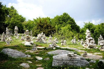 Large collection of stone piles and rock cairns in the stone forest at the vikos gorge in greece on...
