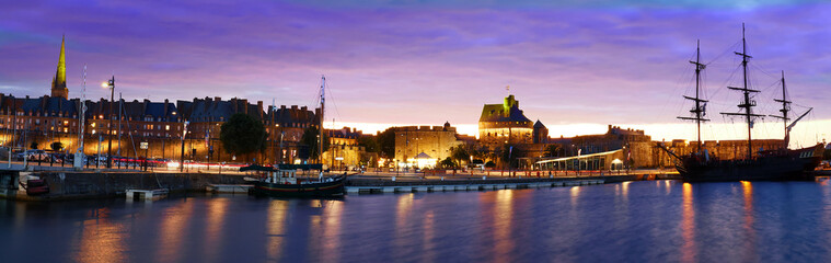 Fototapeta premium Sunset panorama view of atlantic coast walled city historical old town of Saint Malo . Brittany France.