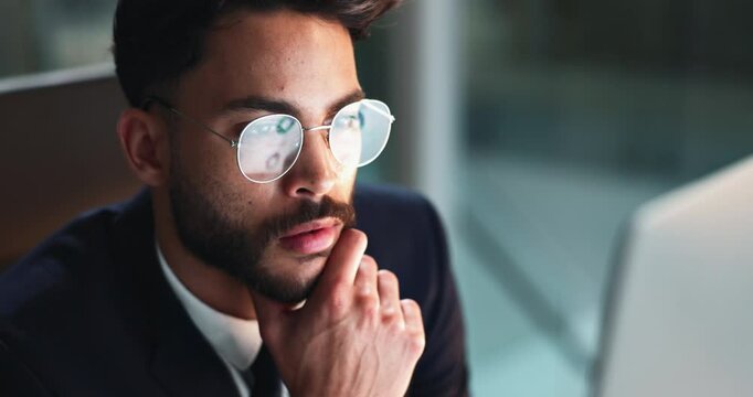 Reading, glasses and businessman in office at night for corporate budget report deadline. Thinking, computer and male financial analyst working overtime for company investment analysis in workplace.