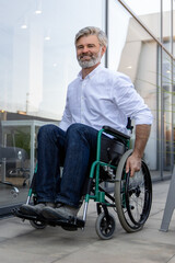 Mature man on a wheelchair looking determined and confident