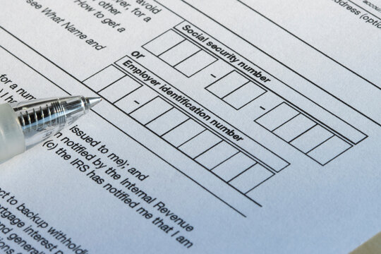 Closeup of the boxes for social security number (SSN) or employer identification number (EIN) on Form W-9, Request for Taxpayer Identification Number (TIN) and Certification.