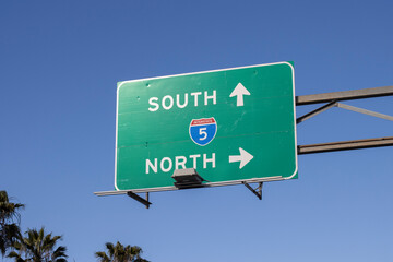Interstate highway I-5 Southbound and Northbound directional signage isolated against a blue sky...