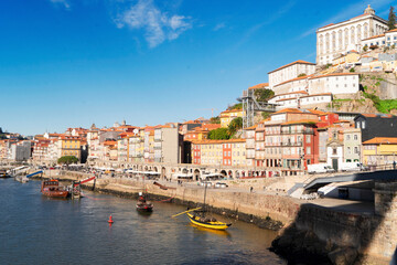 Picturesque, colorful view at old town Porto with bridge, Portugal with bridge Ponte Dom Luis over Douro river. Oporto, touristic mediterranean city