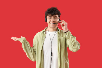Male technical support agent on red background
