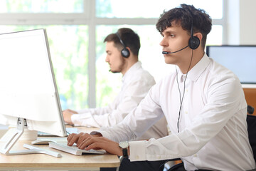 Obraz premium Male technical support agents working in office