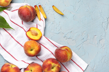 Many sweet peaches on blue background