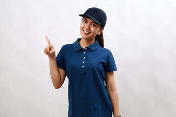 Young asian woman courier wearing delivery uniform and cap showing and pointing up with finger number one while smiling confident and happy.