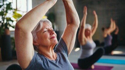 Fototapeta premium Senior Women Practicing Yoga in a Studio