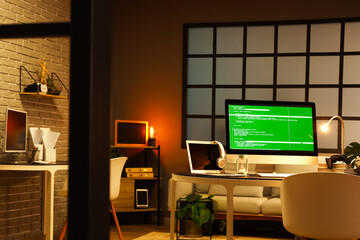 Interior of dark office with programmer's workplaces