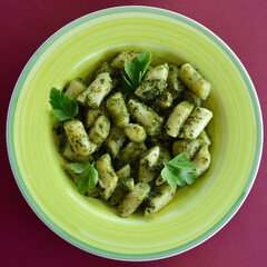 Gnocchi basil pesto on the table.
