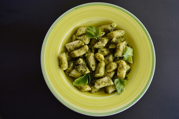 Gnocchi basil pesto on the table.