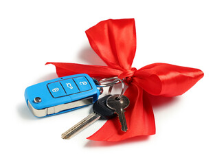 Gift keys of new car with red bow isolated on white background