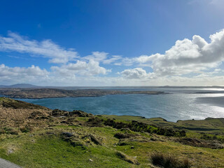 Expansive Ireland Coastal Landscape with Rolling Hills and Ocean Views