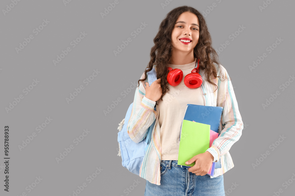 Sticker Female student with copybooks on grey background