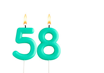 Green birthday candle on white background - Candle number 58