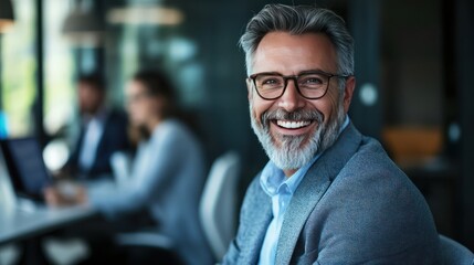 Portrait of a Smiling Man in a Blue Suit and Glasses