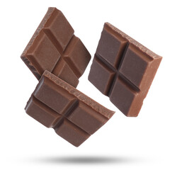 Pieces of sweet chocolate falling on white background