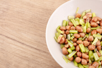 Peanuts with celery in dish