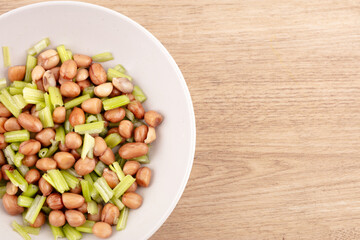 Peanuts with celery in dish