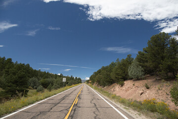 Two-lane Colorado highway with mountains background