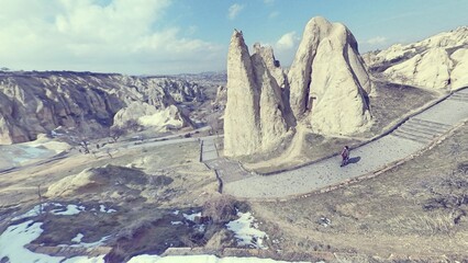 Goreme valley with ancient chapels houses carved into hillside, Cappadocia, Turkey
