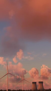 Aerial flight at sunset of some windmills and a nuclear power plant in Doel. Belgium