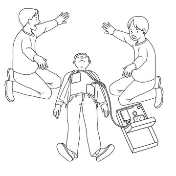 AEDを使って人命救助を行う人　2人