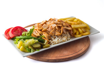 Turkish cuisine. Doner kebab meat with pommes frites potatoes and salad on plate isolated on white background