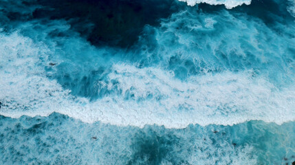 Turquoise ocean sea water white wave splashing deep blue sea. Bird eye view monster wave splash on rock. Tropical sea beach in summer seaside outdoor. Ocean island beautiful dramatic landscape.