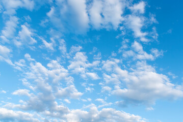 Blue sky fluffy white clouds on summer season bright clear skyline with beautiful cloudscape. Panorama blue sky clouds pattern on daylight with copy space. Cumulus cloudscape air climate sunny day