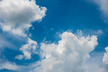 Blue sky fluffy white clouds on summer season bright clear skyline with beautiful cloudscape. Panorama blue sky clouds pattern on daylight with copy space. Cumulus cloudscape air climate sunny day