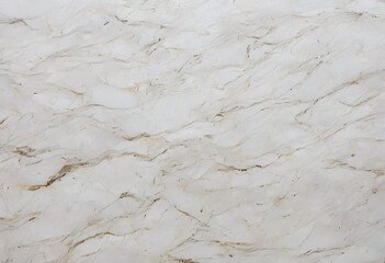 A close-up view of a marble or paper surface featuring intricate veining patterns in shades of white and beige. The texture is smooth and polished.