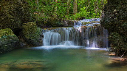 Deep forest waterfall in Thailand. Erawan waterfall National Park Kanjanaburi Thailand.