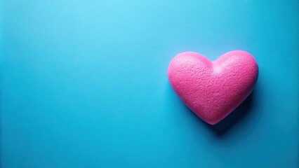 Obraz premium Pink heart on a blue background for Valentine's Day celebration, Valentine's Day, love, romance, heart shape, pink