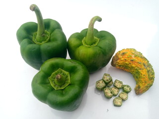 A pile of different vegetables on a white background