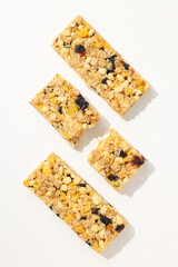 Delicious granola bars on a white background